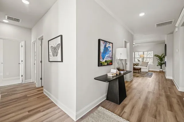 a view of a living room and hardwood floor