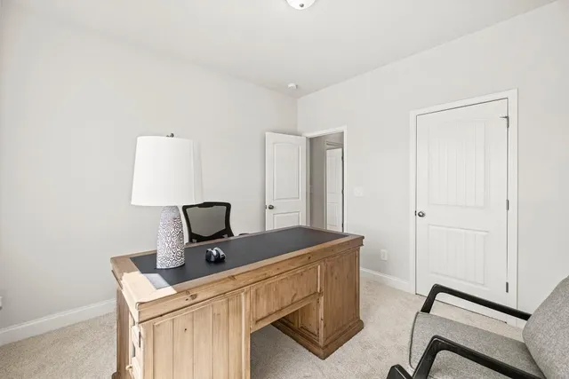 a view of a workspace with furniture