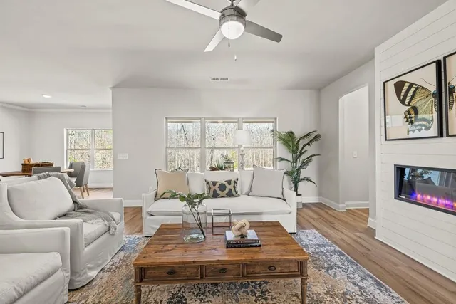 a living room with furniture and a fireplace