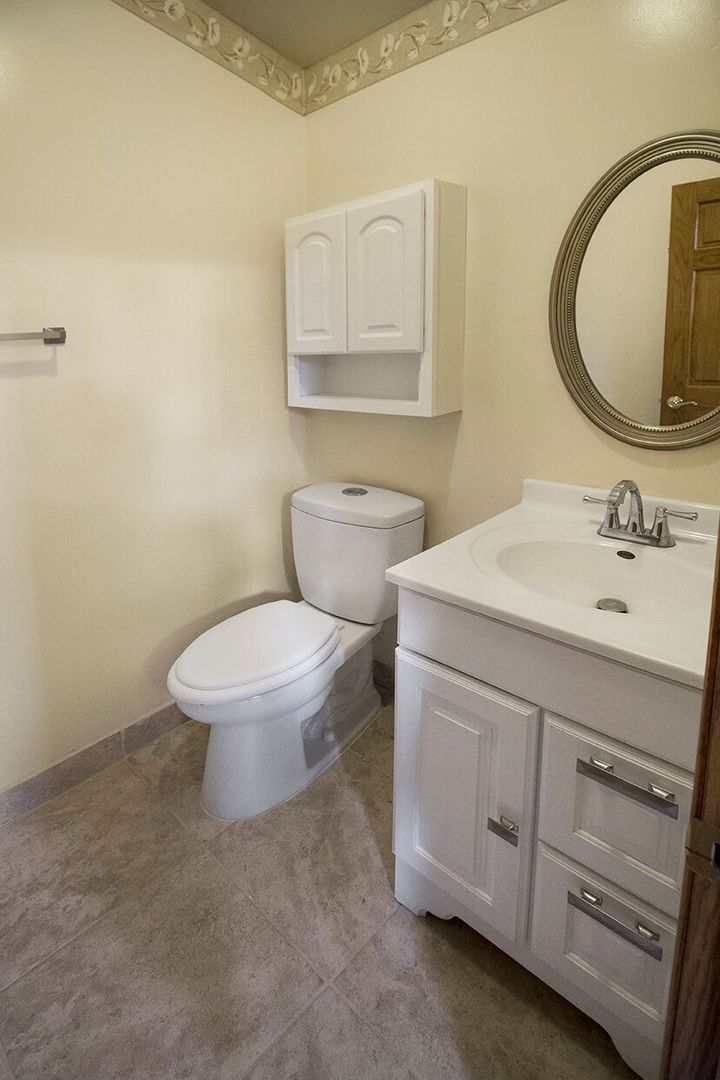 1901 East Burville Road Crete, IL 60417 - Photo 15 of 39 a bathroom with a sink toilet and mirror
