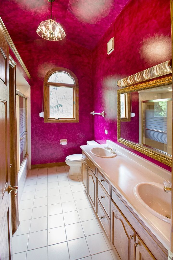 1901 East Burville Road Crete, IL 60417 - Photo 16 of 39 a bathroom with a sink a vanity and a mirror