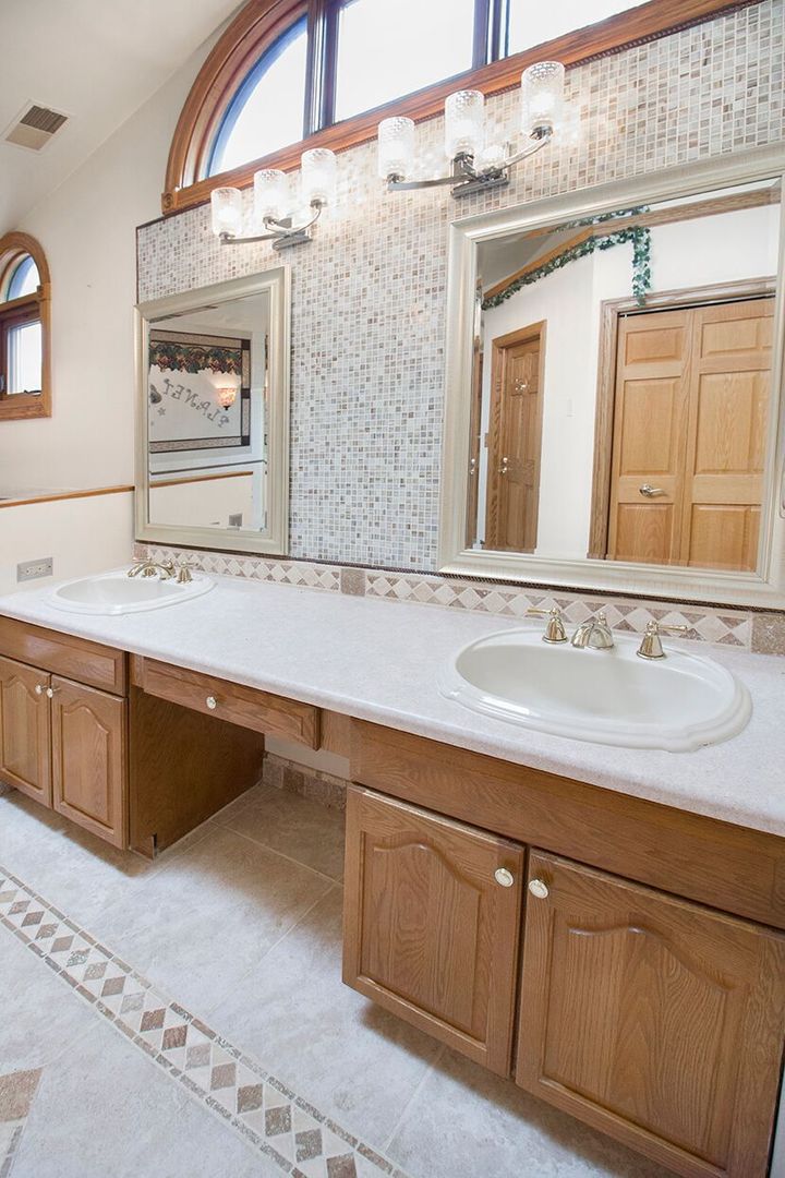 1901 East Burville Road Crete, IL 60417 - Photo 19 of 39 a bathroom with a sink and a mirror