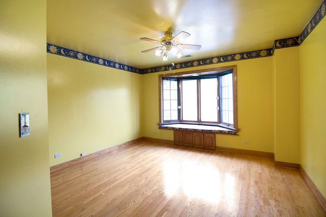 1901 East Burville Road Crete, IL 60417 - Photo 20 of 39 a view of an empty room with a window and hardwood