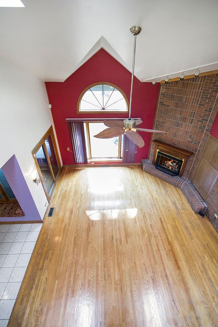 1901 East Burville Road Crete, IL 60417 - Photo 27 of 39 a view of a bedroom with a bed and wooden floor
