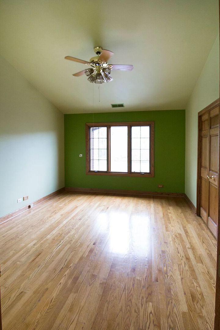 1901 East Burville Road Crete, IL 60417 - Photo 29 of 39 a view of empty room with wooden floor and fan