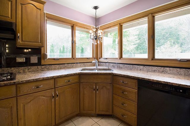 1901 East Burville Road Crete, IL 60417 - Photo 35 of 39 a kitchen with stainless steel appliances granite countertop a sink and a window