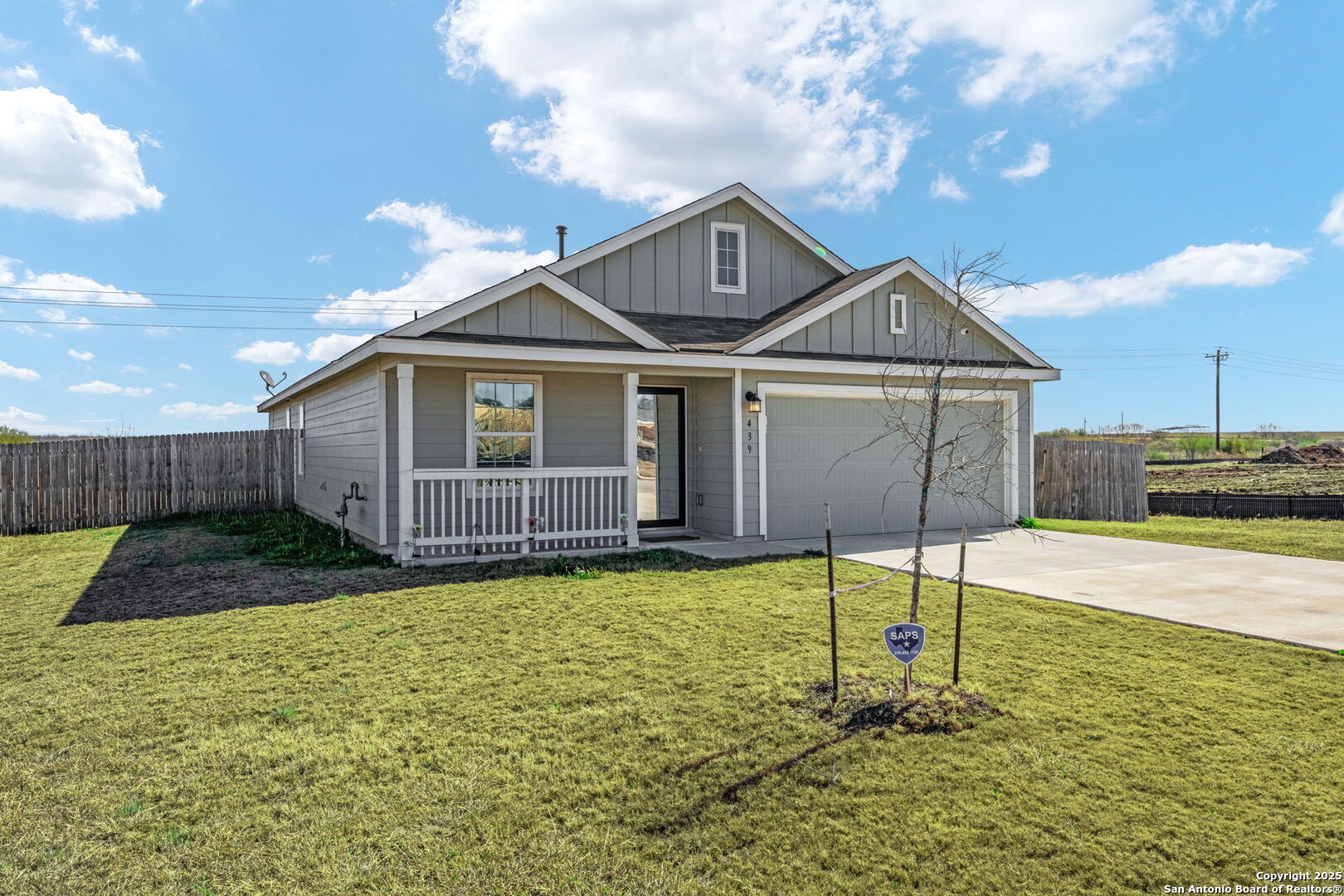 439 Agave Circle Jourdanton, TX 78026 - Photo 2 of 27 a porch with yard and outdoor seating