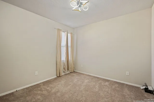 a view of chairs and a table in the roof deck