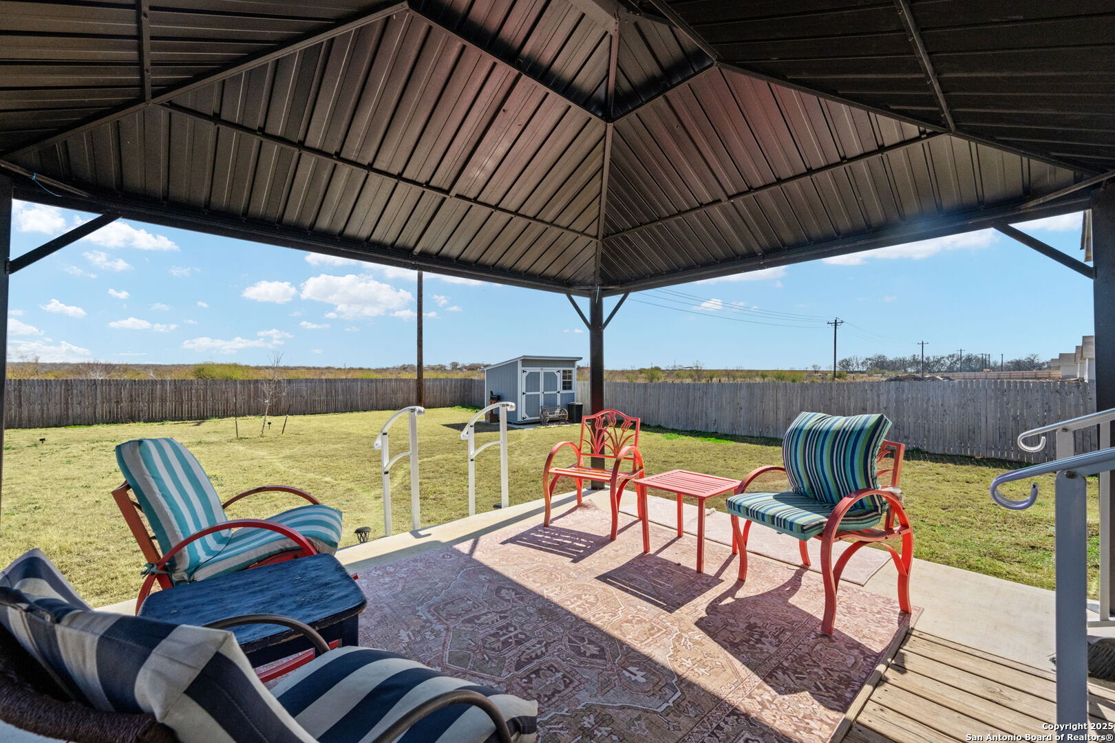 439 Agave Circle Jourdanton, TX 78026 - Photo 24 of 27 a view of chairs and a table in the roof deck
