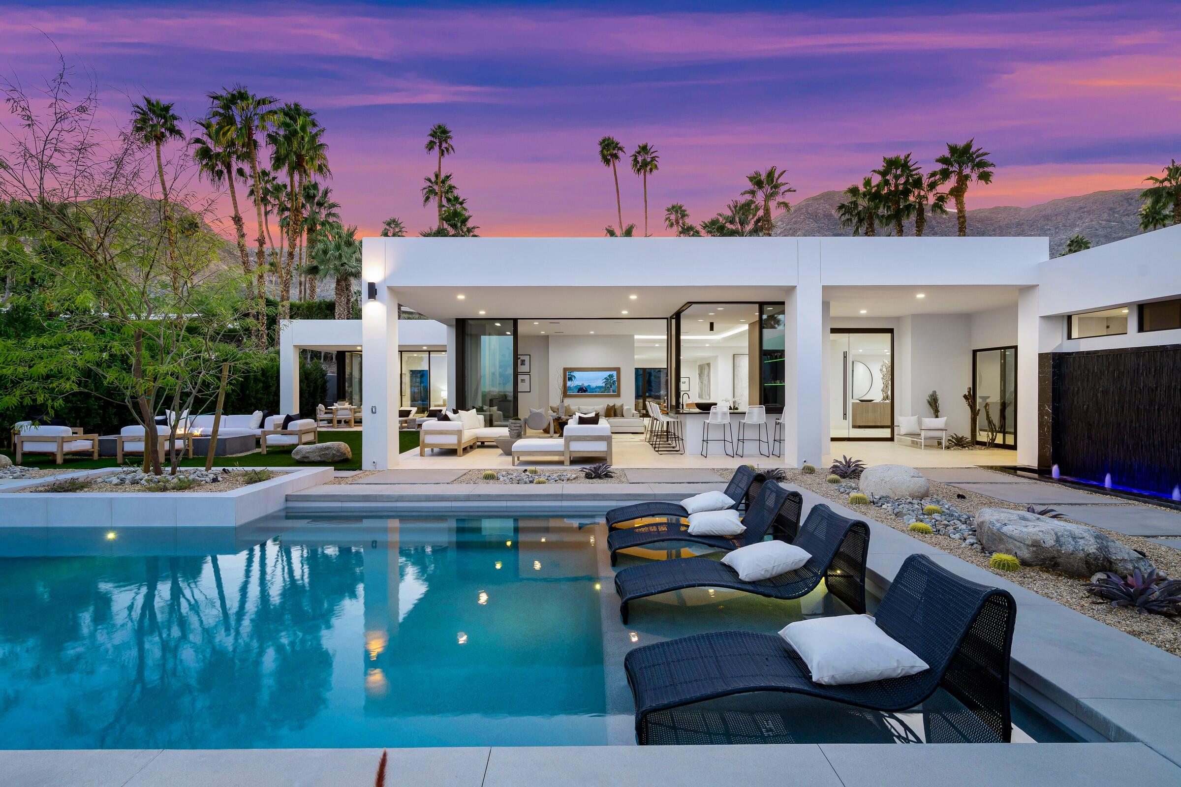 a view of a patio with couches table and chairs