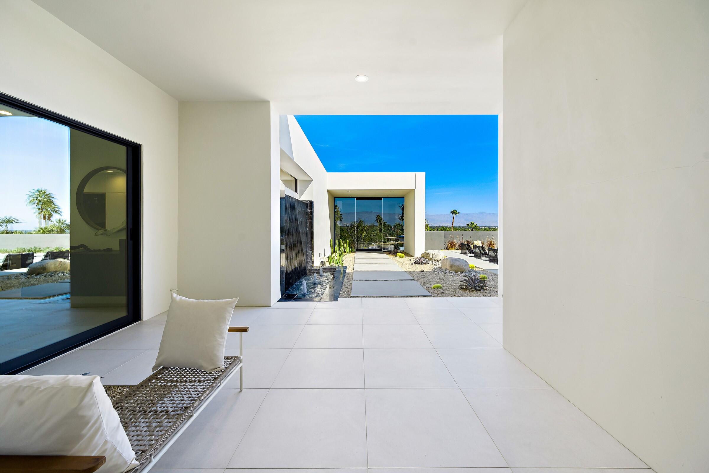 70345 Pecos Road Rancho Mirage, CA 92270 - Photo 14 of 72 a lobby with a couch and a potted plant