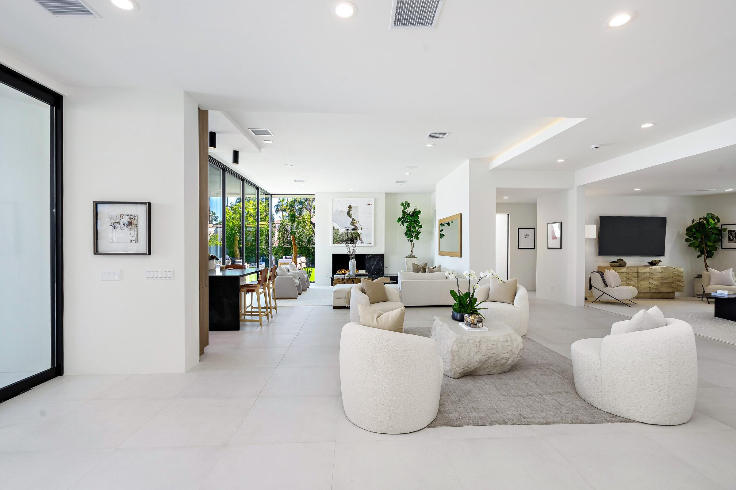 70345 Pecos Road Rancho Mirage, CA 92270 - Photo 16 of 72 a living room with fireplace furniture and a large window