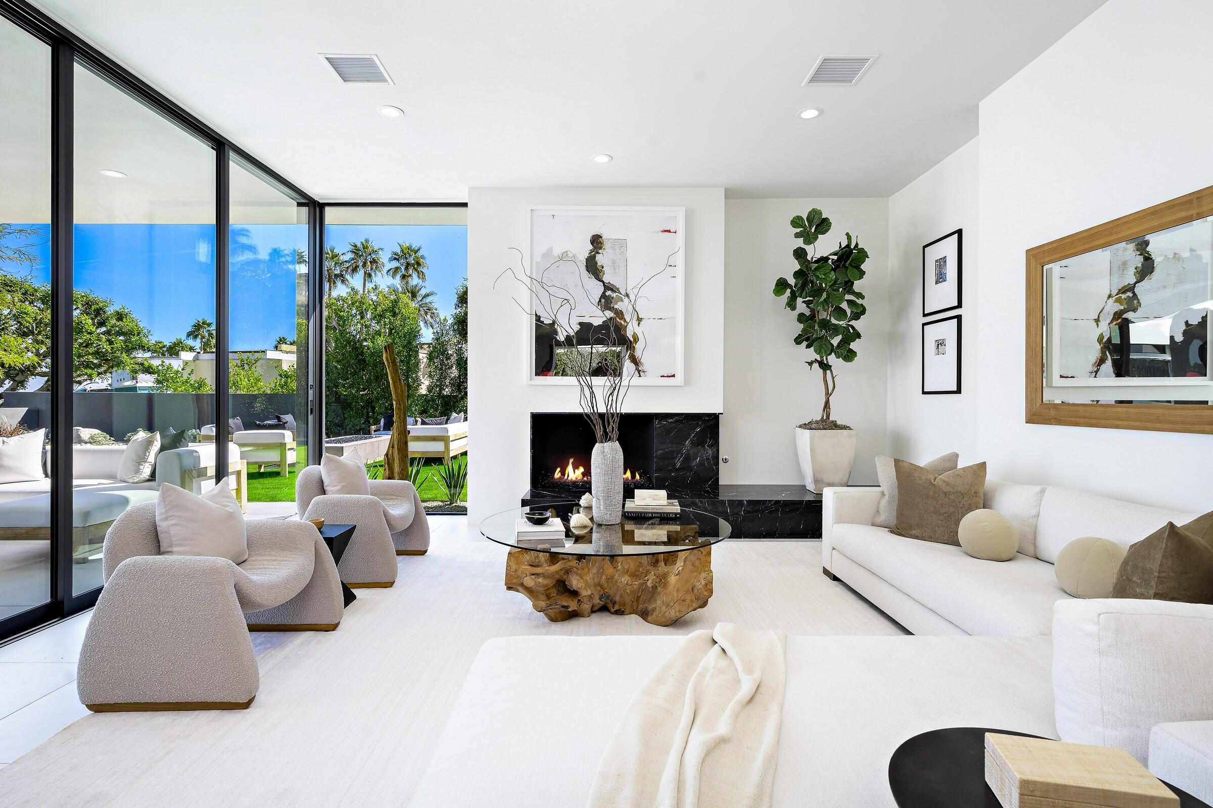 70345 Pecos Road Rancho Mirage, CA 92270 - Photo 23 of 72 a living room with furniture potted plant and a large window