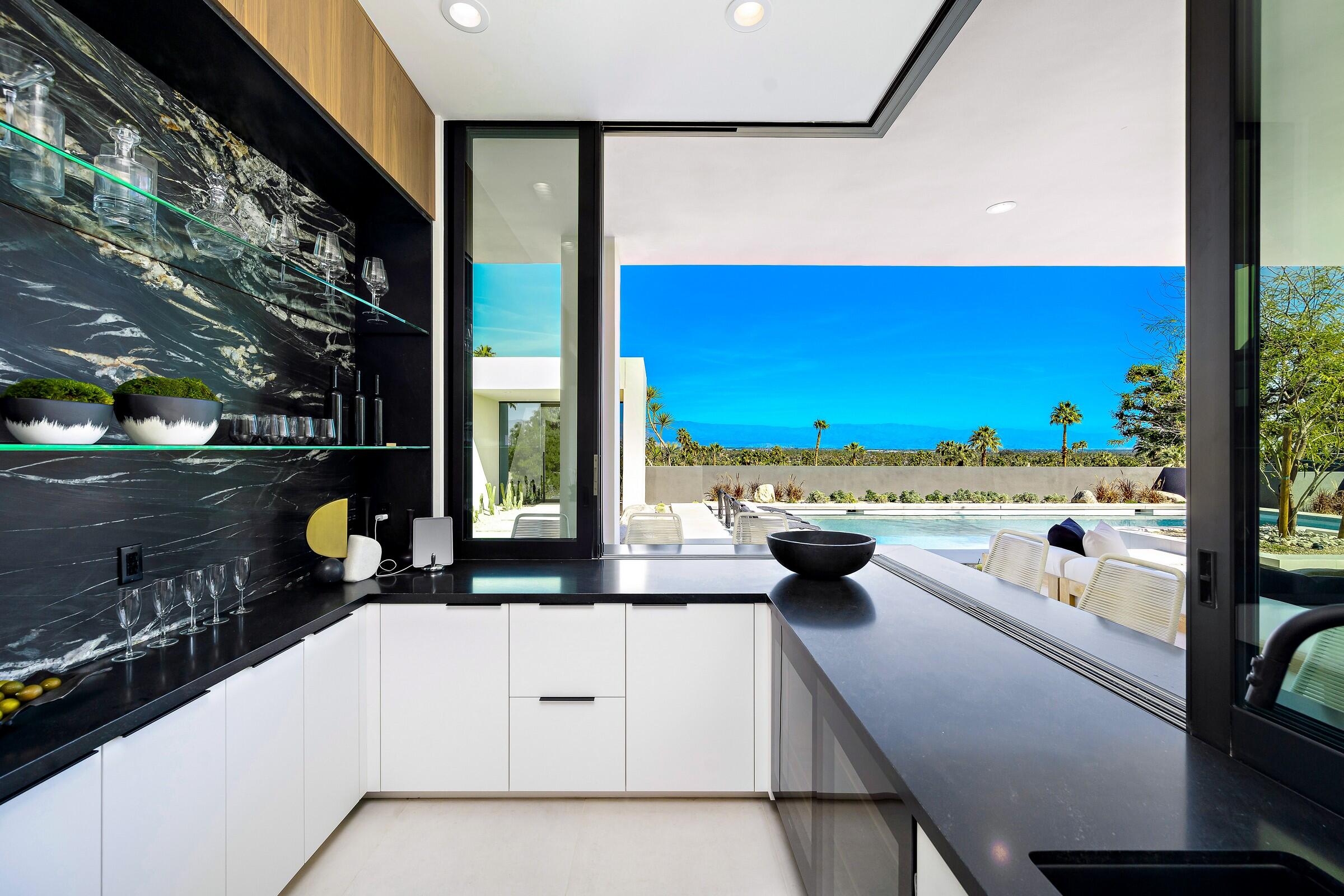 70345 Pecos Road Rancho Mirage, CA 92270 - Photo 25 of 72 a kitchen with stainless steel appliances lots of counter top space