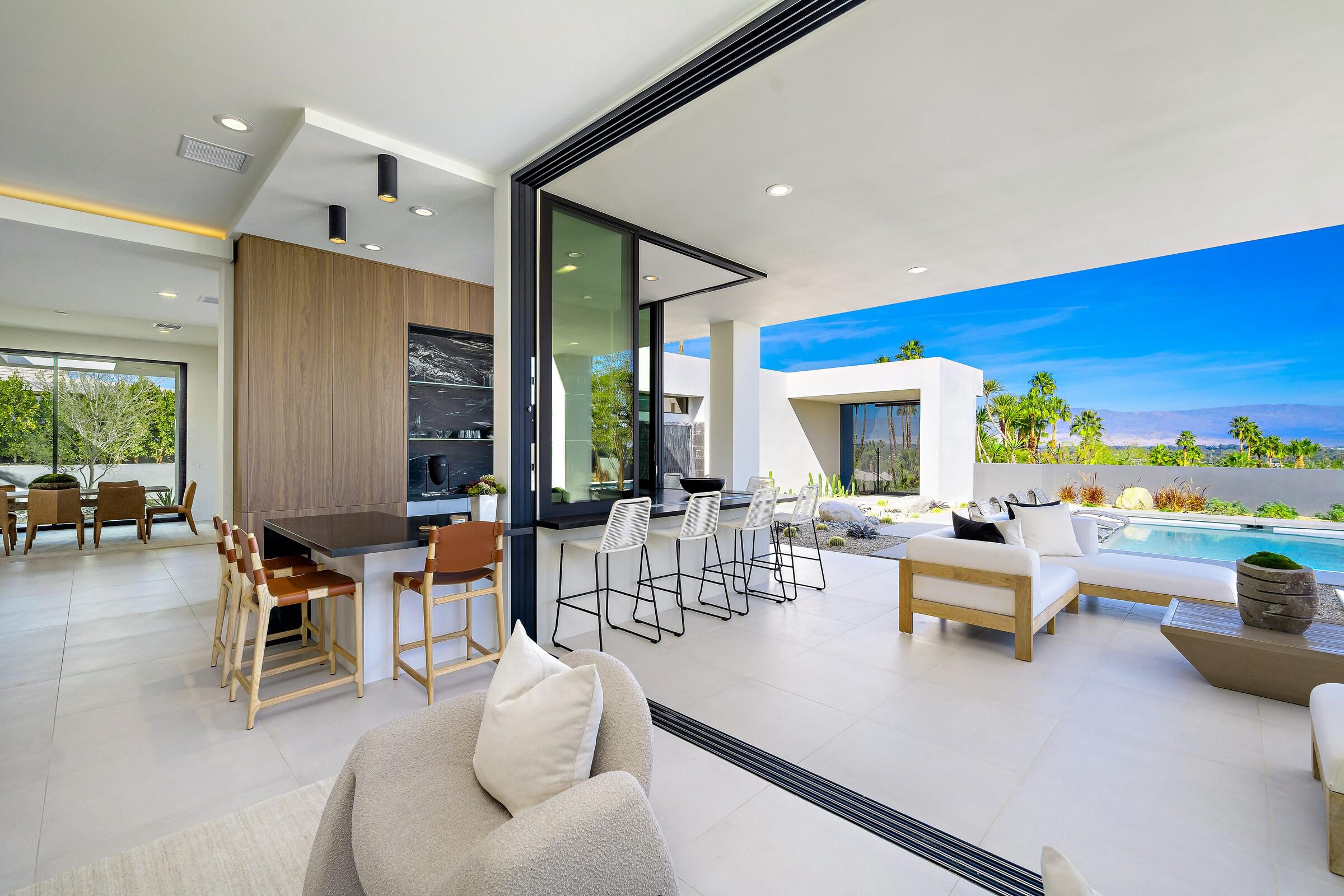 70345 Pecos Road Rancho Mirage, CA 92270 - Photo 27 of 72 a living room with furniture and a large window