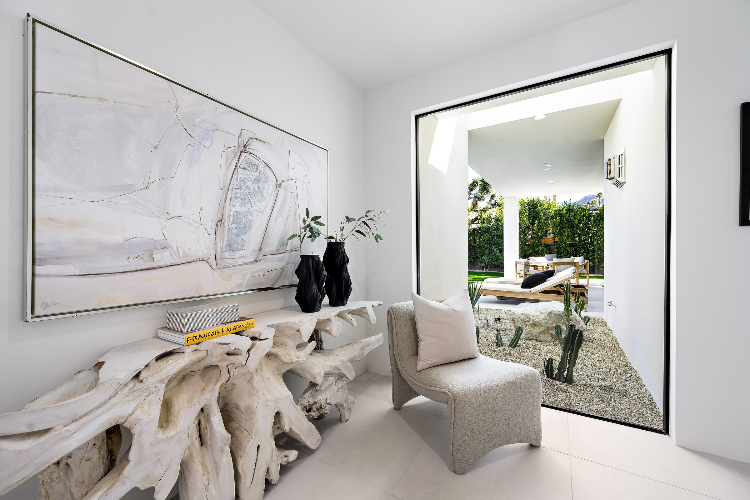 70345 Pecos Road Rancho Mirage, CA 92270 - Photo 42 of 72 a living room with furniture and a large window