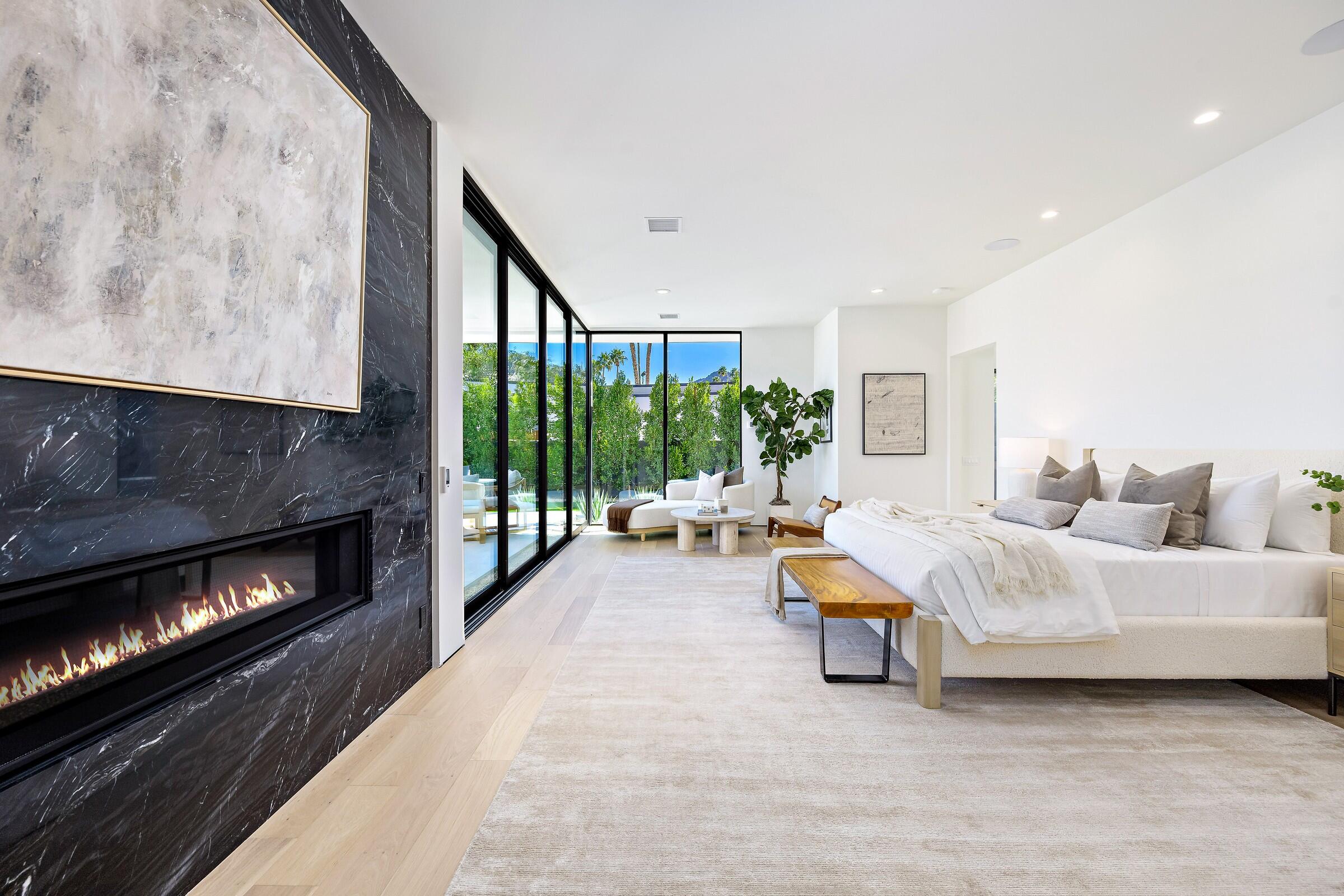 70345 Pecos Road Rancho Mirage, CA 92270 - Photo 43 of 72 a living room with furniture and a fireplace