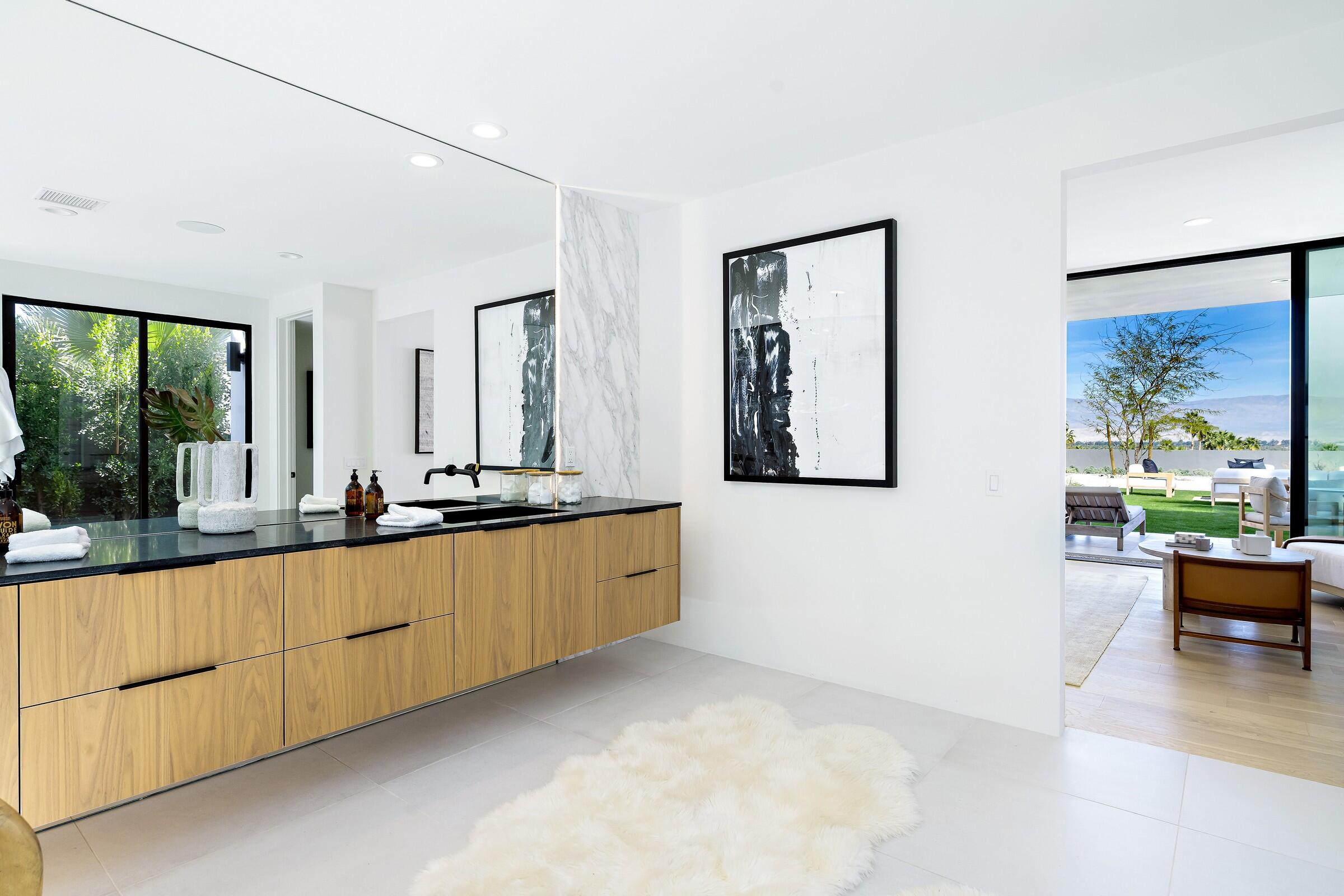 70345 Pecos Road Rancho Mirage, CA 92270 - Photo 49 of 72 a large living room with stainless steel appliances kitchen island granite countertop furniture and a large window