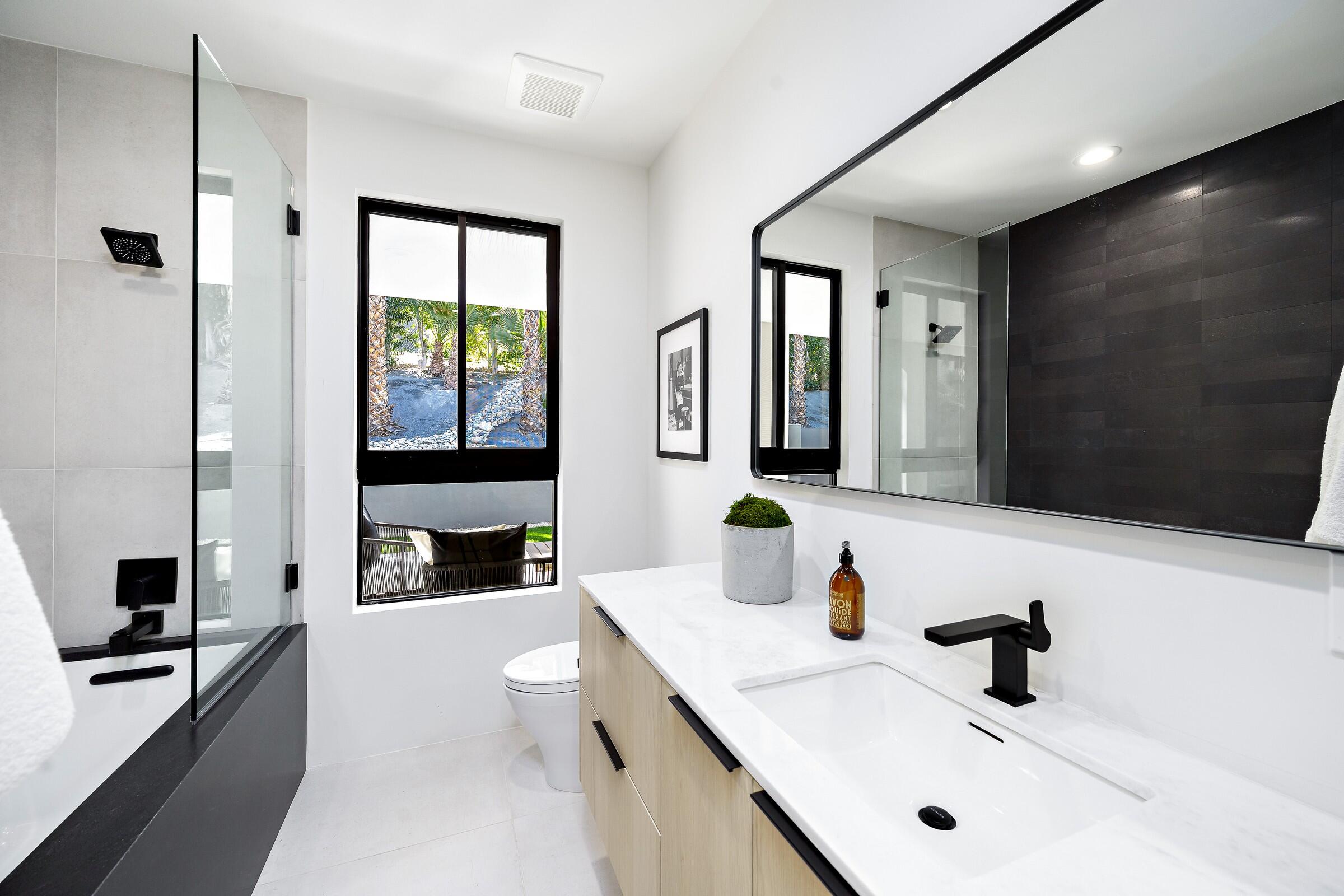 70345 Pecos Road Rancho Mirage, CA 92270 - Photo 53 of 72 a bathroom with double vanity sink and a mirror