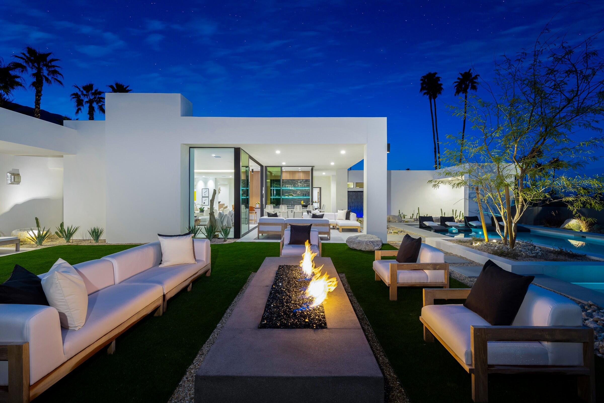 70345 Pecos Road Rancho Mirage, CA 92270 - Photo 10 of 72 a living room with furniture fireplace and a table