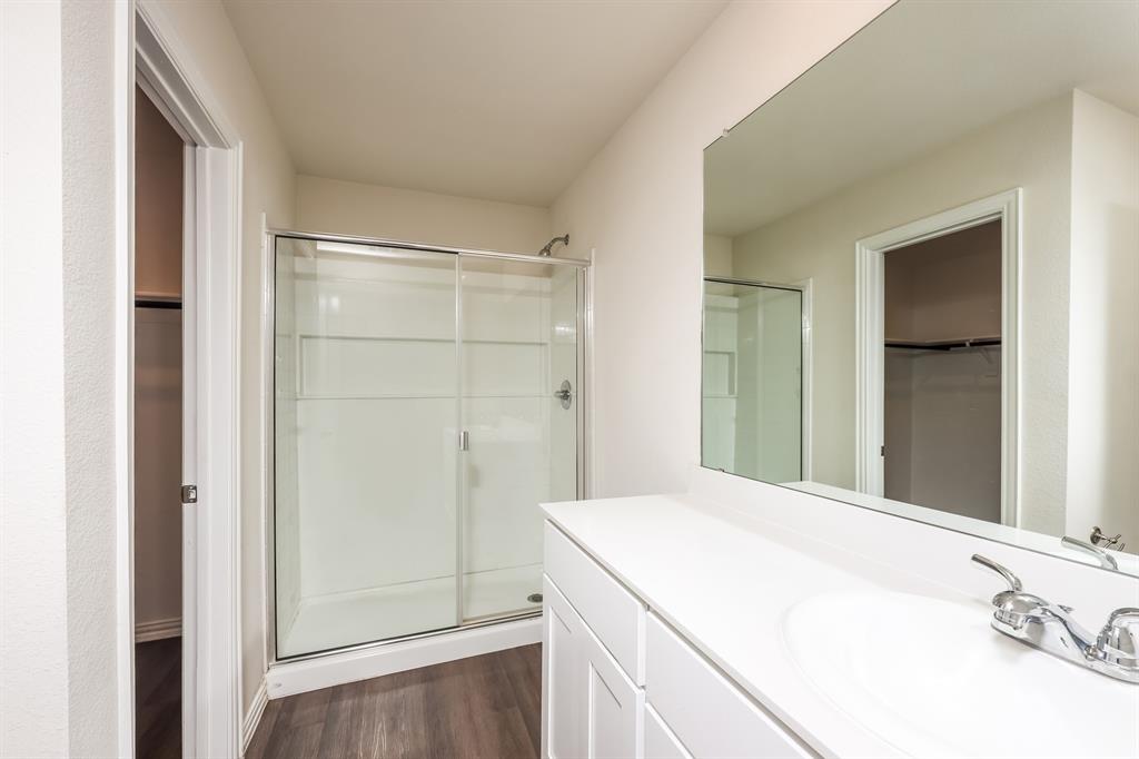 5108 Kilpatrick Avenue Fort Worth, TX 76107 - Photo 14 of 21 a bathroom with a granite countertop sink and shower