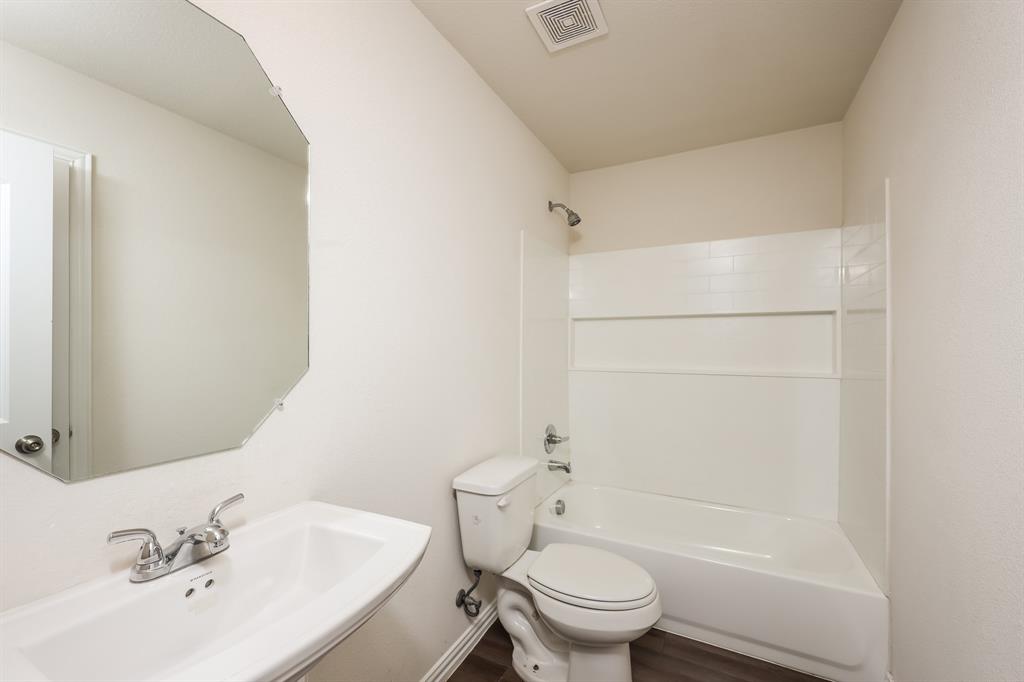 5108 Kilpatrick Avenue Fort Worth, TX 76107 - Photo 17 of 21 a bathroom with a sink toilet and shower