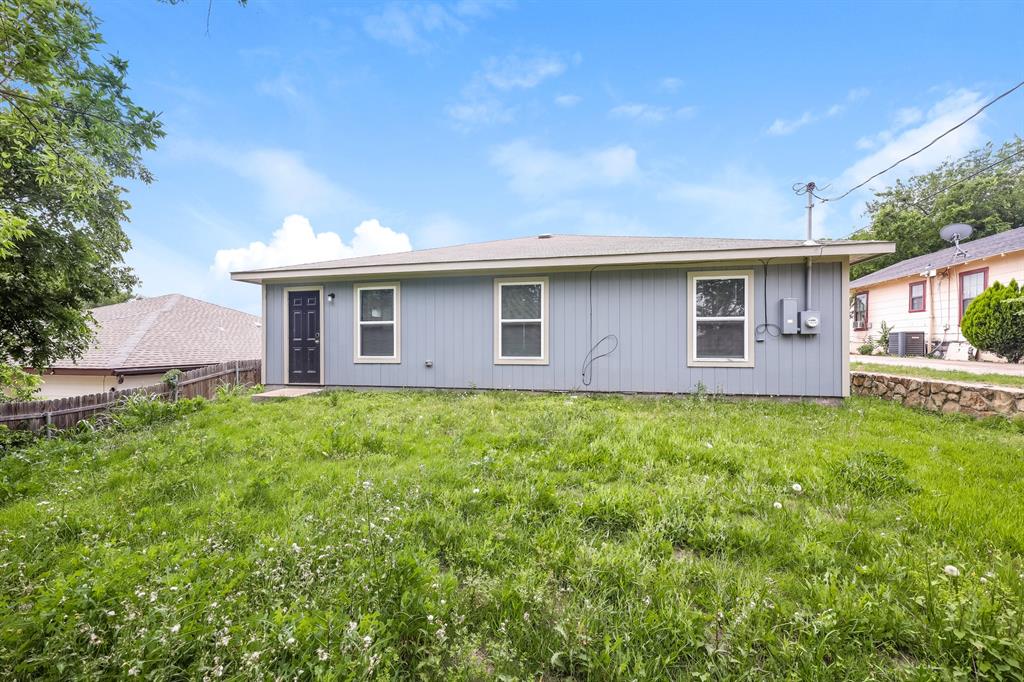 5108 Kilpatrick Avenue Fort Worth, TX 76107 - Photo 19 of 21 a front view of a house with a garden