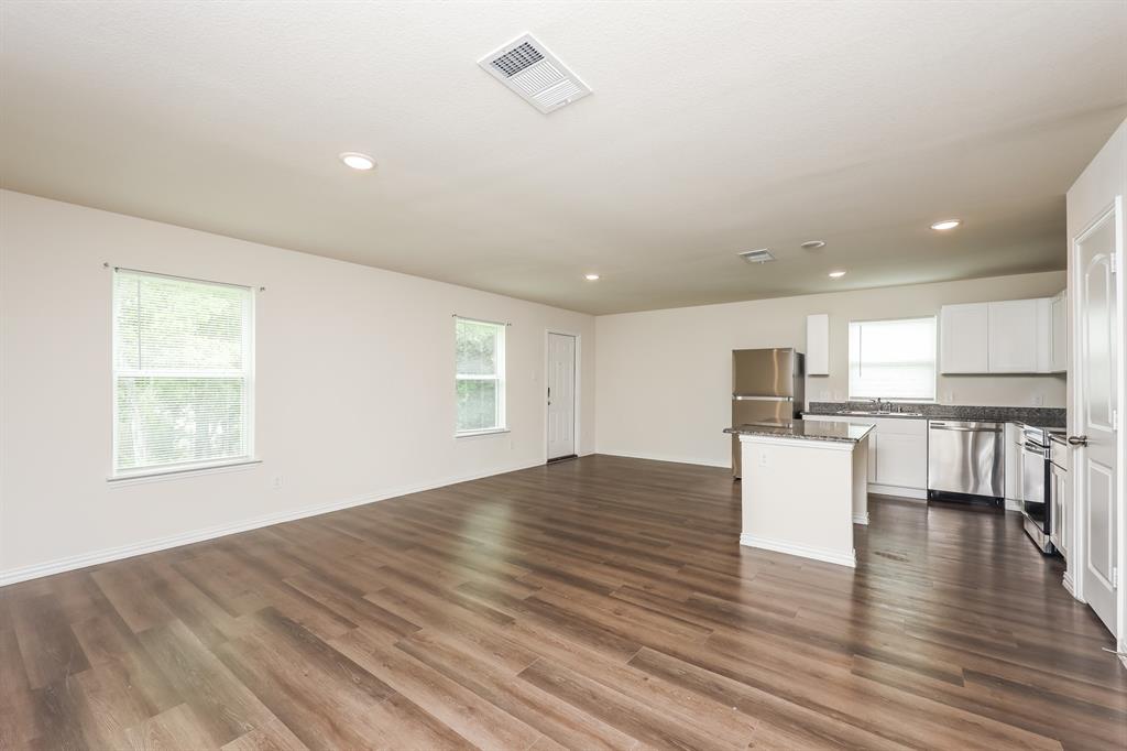 5108 Kilpatrick Avenue Fort Worth, TX 76107 - Photo 6 of 21 a view of kitchen with microwave and wooden floor