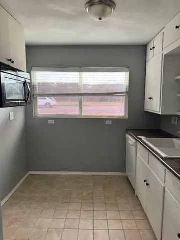 a kitchen with a stove and a refrigerator