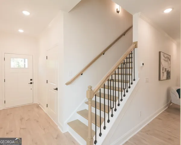 a view of a hallway with staircase