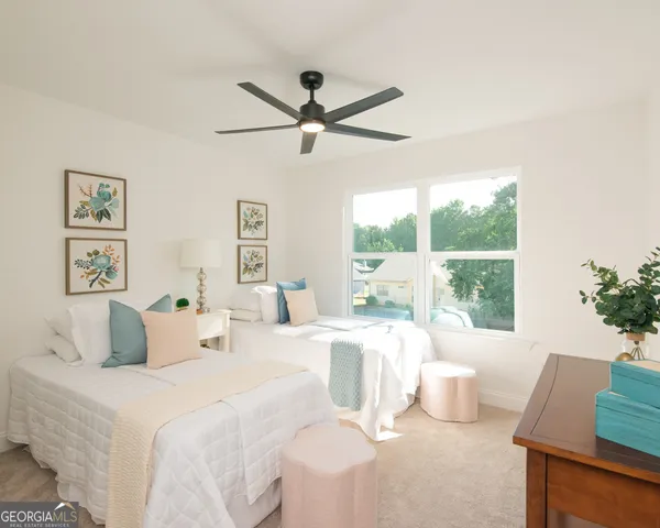 a bedroom with a large bed and a window