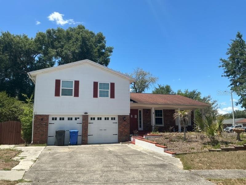 1702 Ketch Place Brandon, FL 33511 - Photo 1 of 14 a front view of a house with a yard
