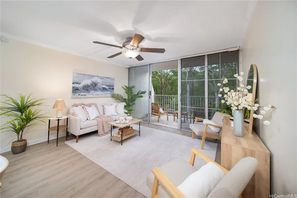 a living room with furniture and a large window