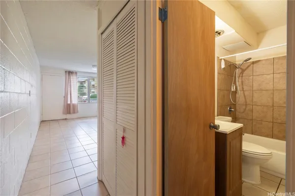 a view of a bathroom with a toilet and a shower