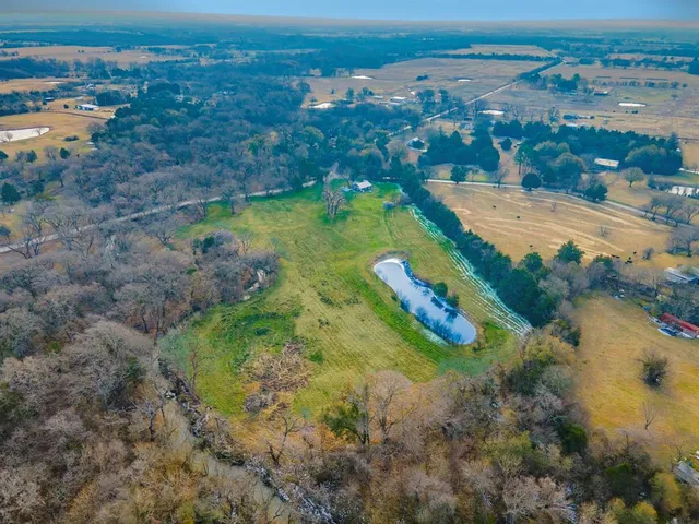 a view of a lake with a yard