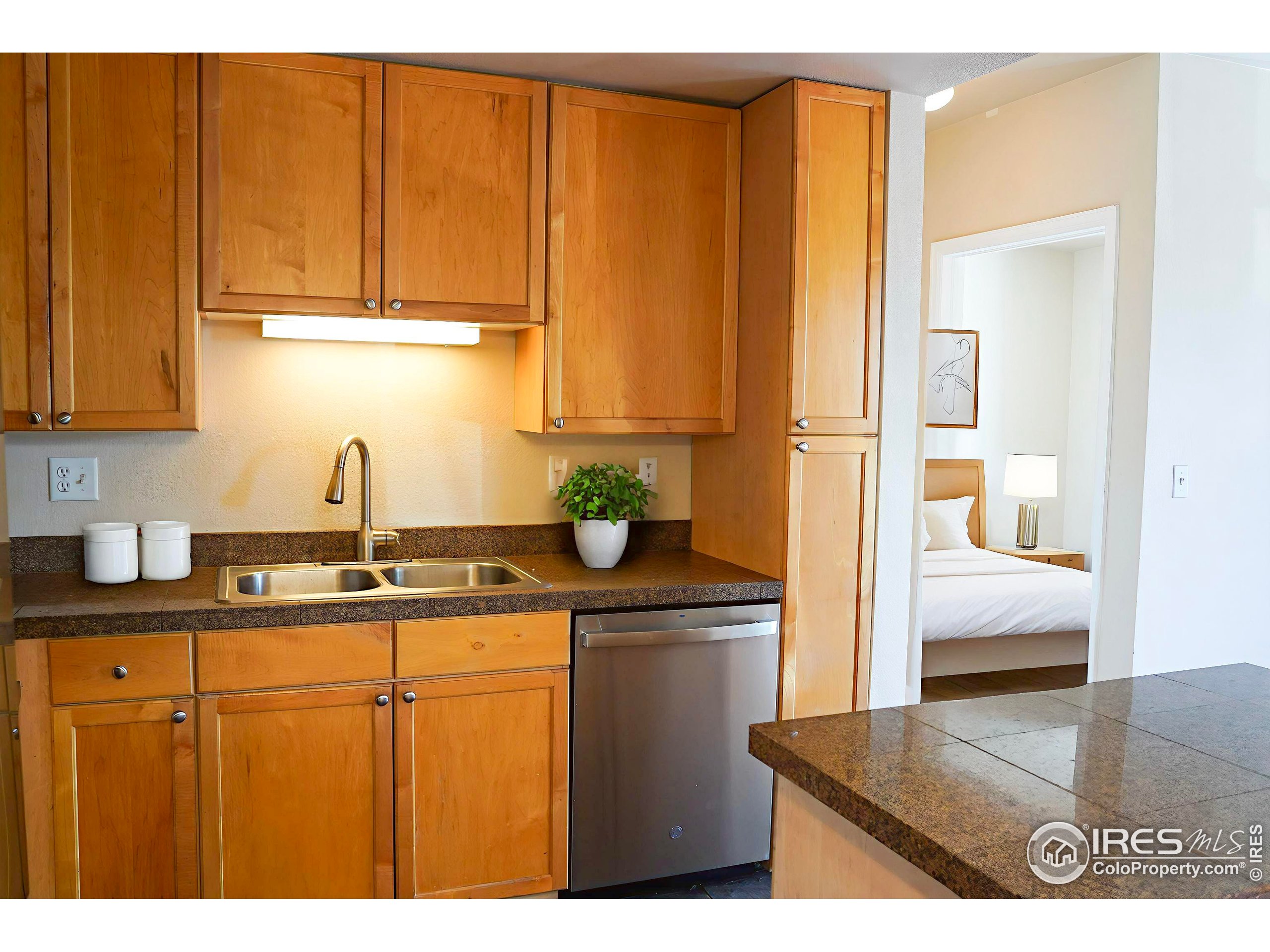 4500 Baseline Road, Unit 4104 Boulder, CO 80303 - Photo 4 of 14 a kitchen with sink and cabinets