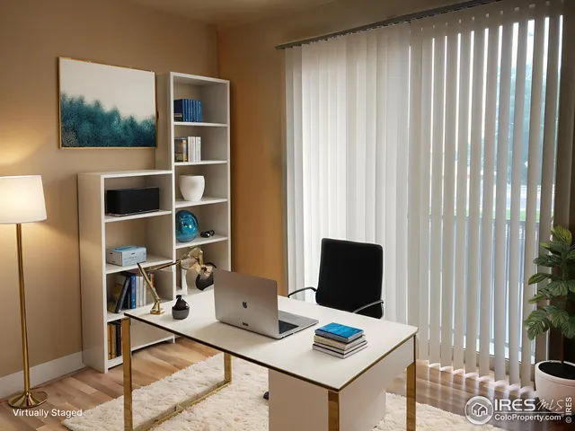 a laptop computer sitting on top of a desk