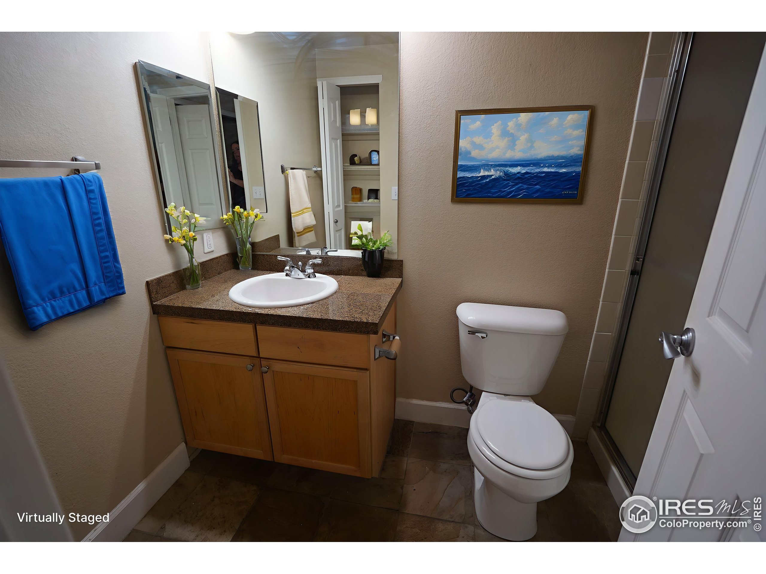 4500 Baseline Road, Unit 4104 Boulder, CO 80303 - Photo 9 of 14 a bathroom with a toilet sink and mirror