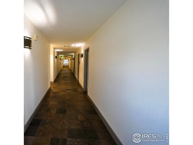 a view of a hallway with a white walls