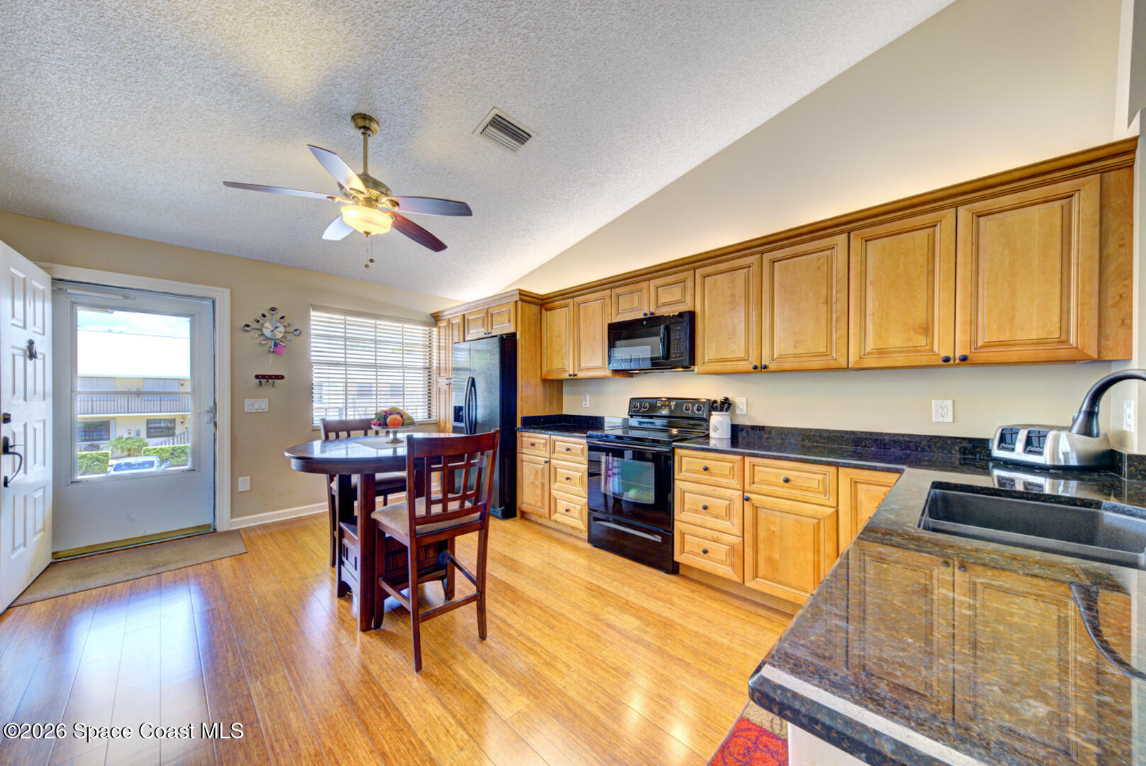 1142 Keystone Drive, Unit F Jupiter, FL 33458 - Photo 10 of 43 kitchen with granite countertops