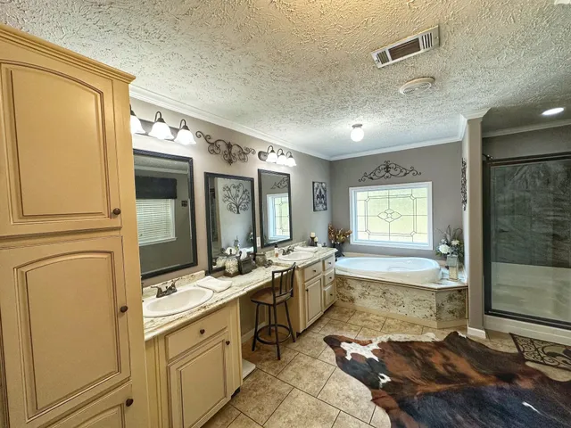 a room with sink cabinets and appliances
