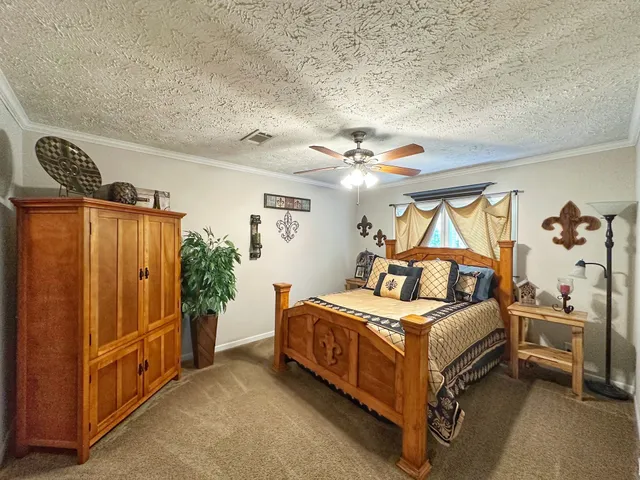 a bed room with a bed and a chandelier