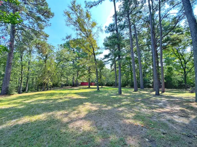 a view of a backyard with a barn