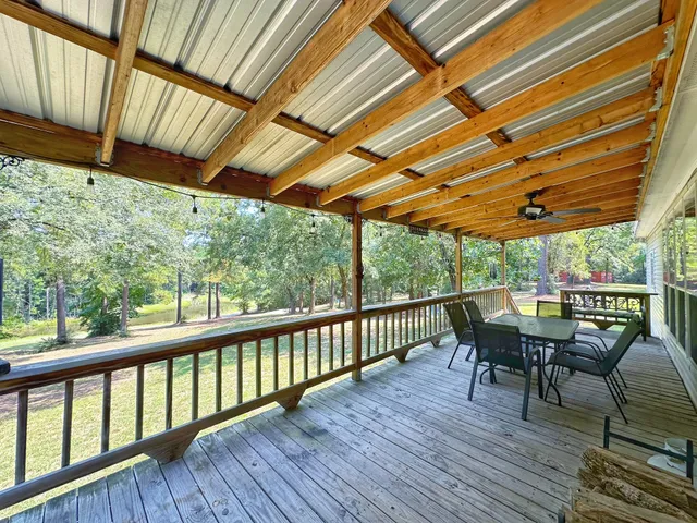 a view of a two chairs and table in the balcony