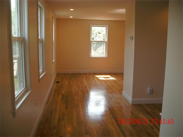 78 Taylor Street Boston, MA 02122 - Photo 11 of 13 a view of hallway with wooden floor
