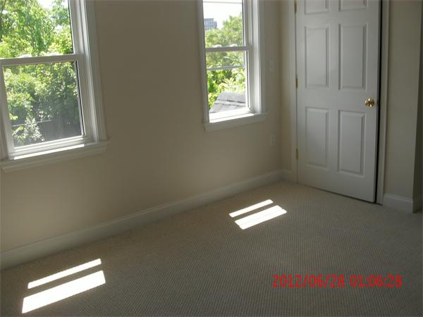 78 Taylor Street Boston, MA 02122 - Photo 12 of 13 a view of an empty room with a window
