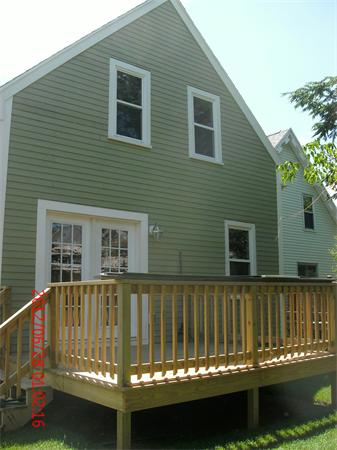 78 Taylor Street Boston, MA 02122 - Photo 2 of 13 a view of a house with a balcony