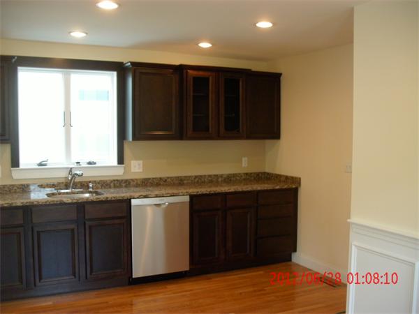 78 Taylor Street Boston, MA 02122 - Photo 4 of 13 a kitchen with a sink and cabinets