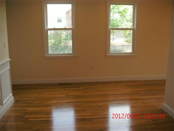 78 Taylor Street Boston, MA 02122 - Photo 7 of 13 a view of a room with wooden floor and window
