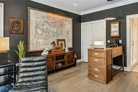 a bedroom with furniture and a window